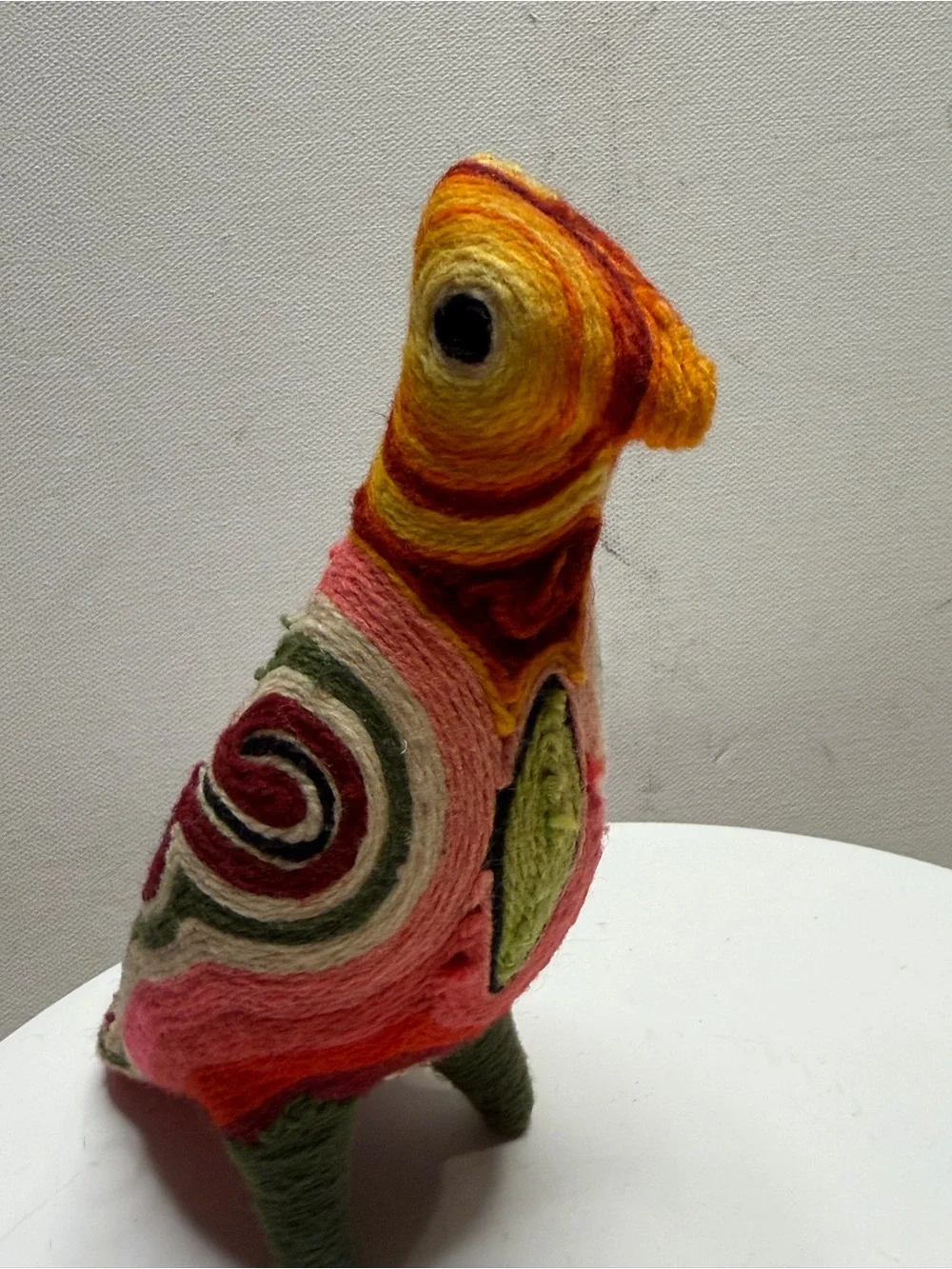 traditional bird figurine in the Huichol yarn art style